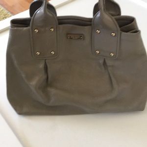 A grey Kate spade bag